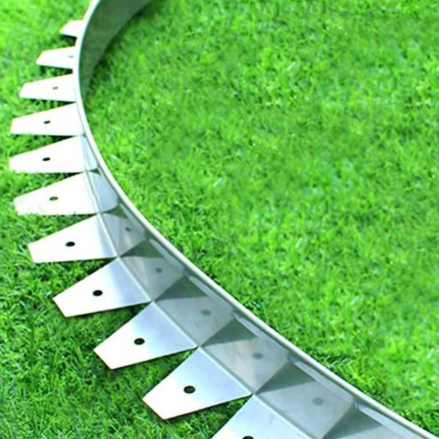 Stainless steel garden edging along a lawn